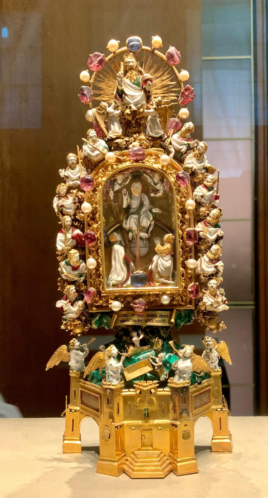 The Holy Thorn Reliquary, a gold shrine set with pearls and rubies and crowded with enamel figures of Christ, the apostles and angels.