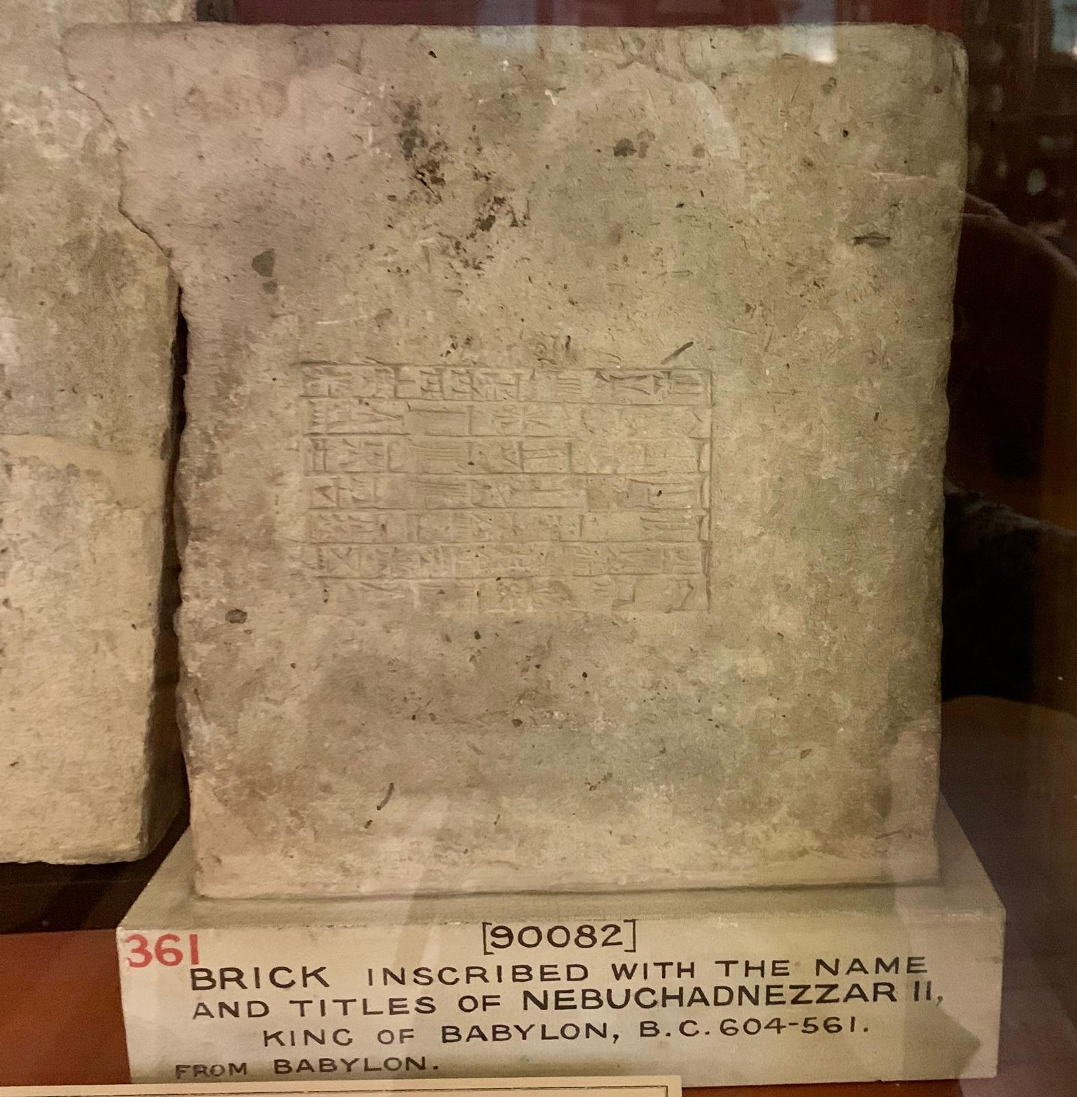 A baked clay brick stamped with the name and titles of Nebuchadnezzar II, King of Babylon.